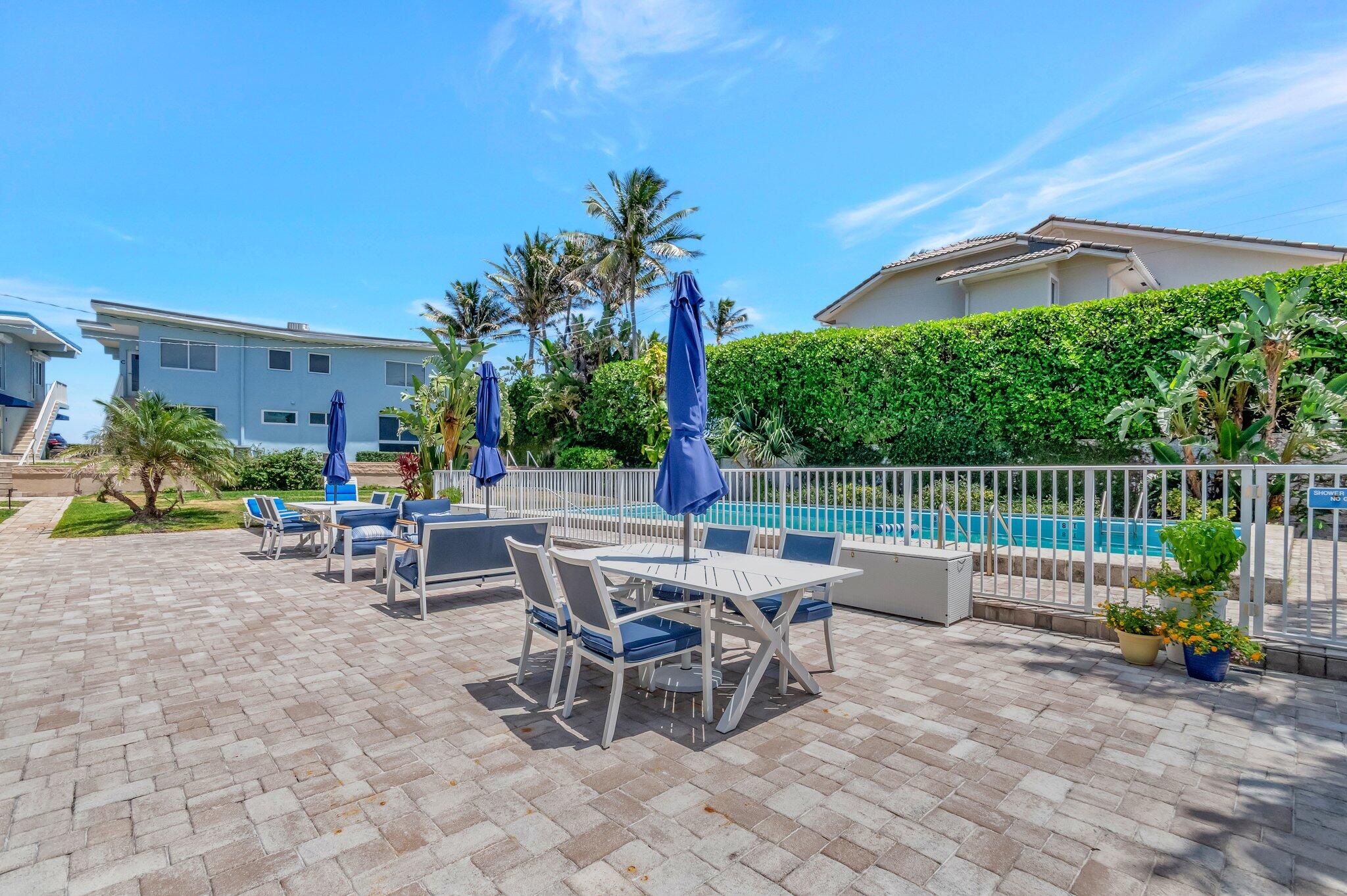 5700 Old Ocean Boulevard, Unit R Ocean Ridge, FL 33435 - Photo 15 of 20 a view of a patio with a table and chairs