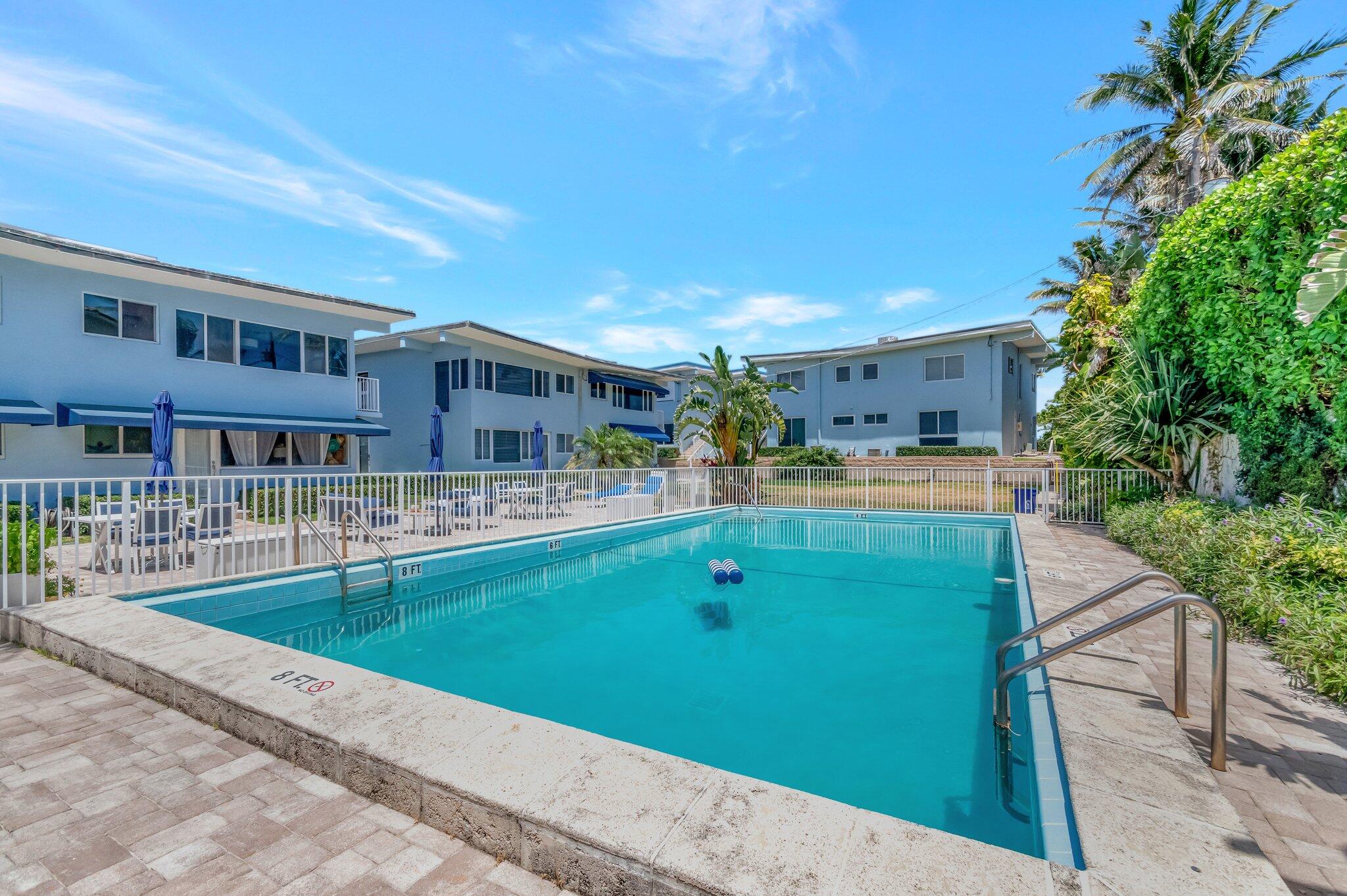 5700 Old Ocean Boulevard, Unit R Ocean Ridge, FL 33435 - Photo 16 of 20 a view of a patio with a table and chairs