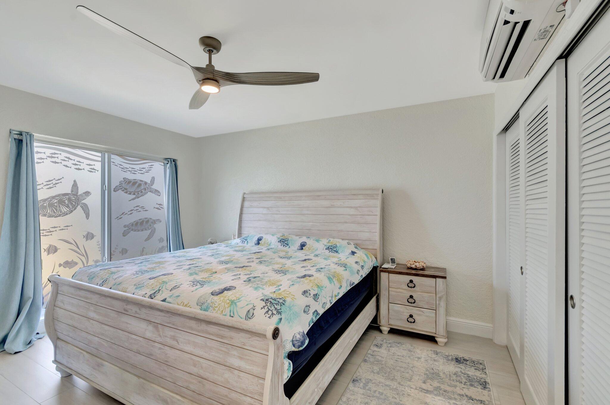 5700 Old Ocean Boulevard, Unit R Ocean Ridge, FL 33435 - Photo 10 of 20 a bedroom with a bed and a dresser