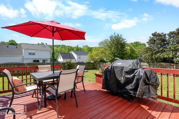 a view of a chairs and table in the patio