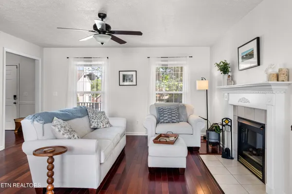 a living room with furniture and a fireplace