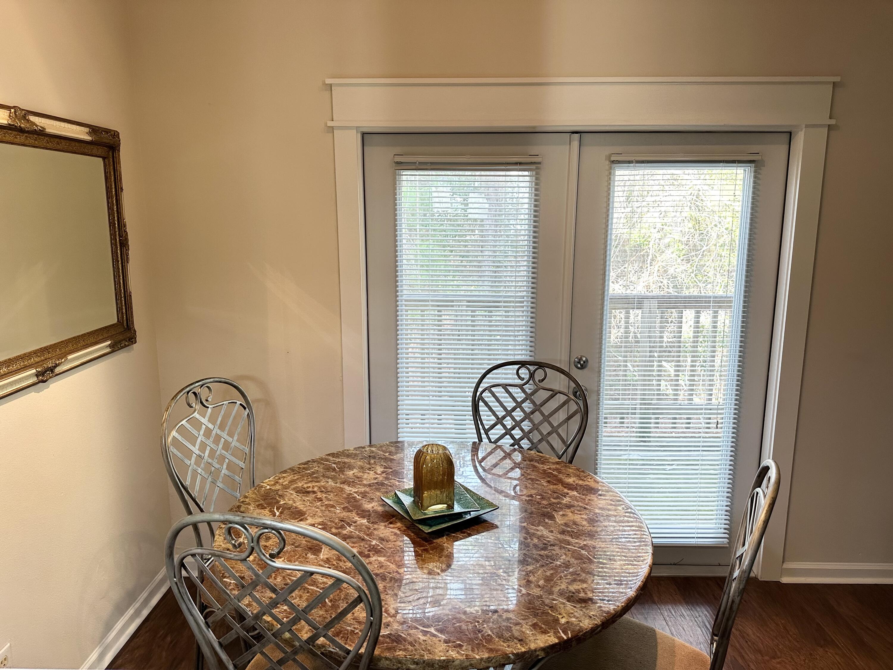 732 East Mack Bayou Drive, Unit 2 Santa Rosa Beach, FL 32459 - Photo 8 of 43 a table with chair and window