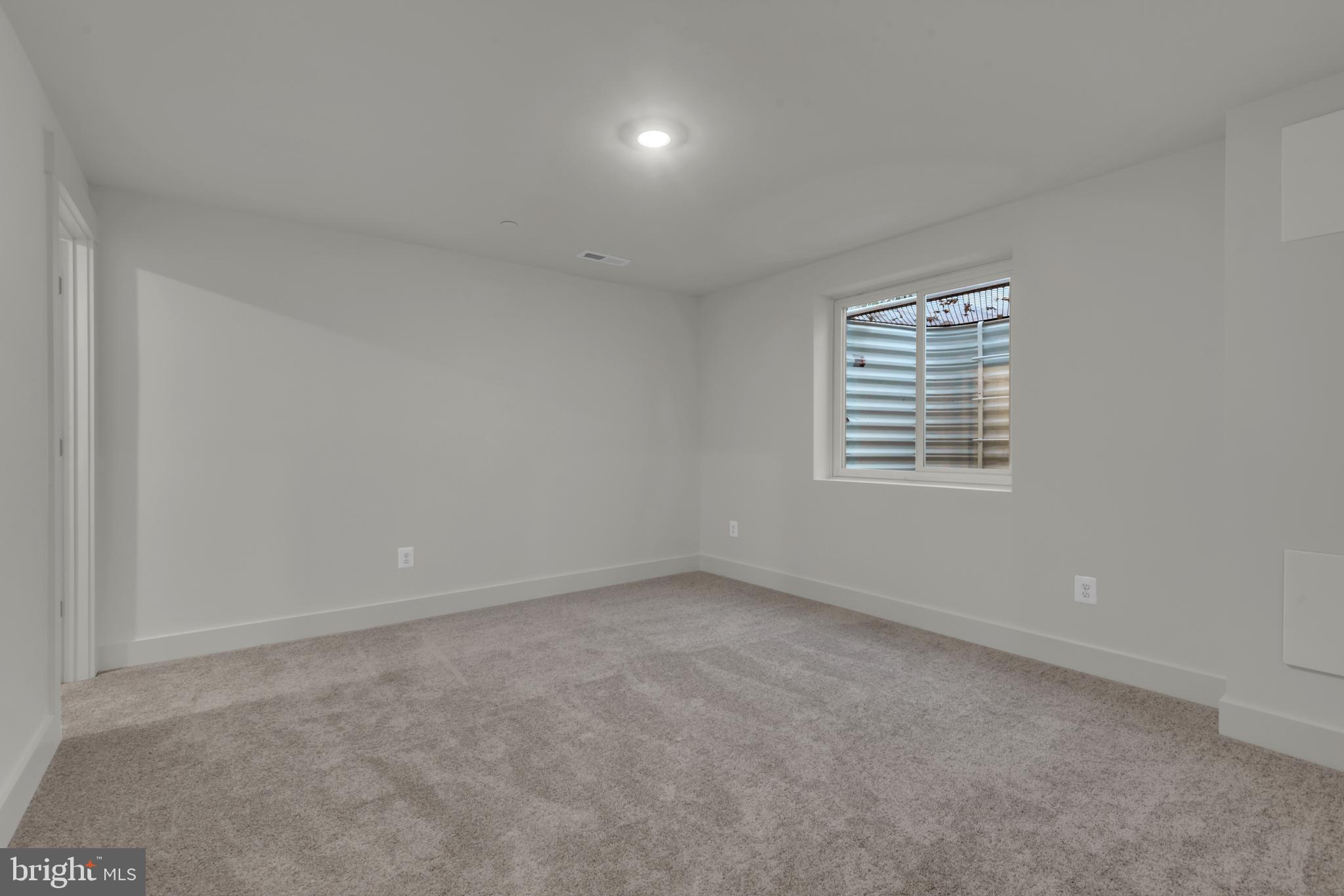 6502 Whitetail Xing Way Hanover, MD 21076 - Photo 36 of 58 an empty room with a window