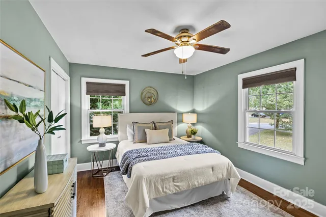 a bedroom with a large bed and a window