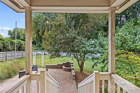 a view of a balcony and trees from a balcony