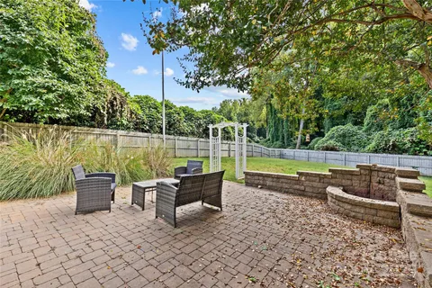 an outdoor sitting area with a lake view