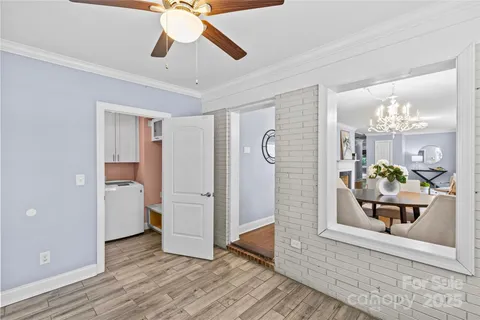 a view of a hallway view with wooden floor and staircase