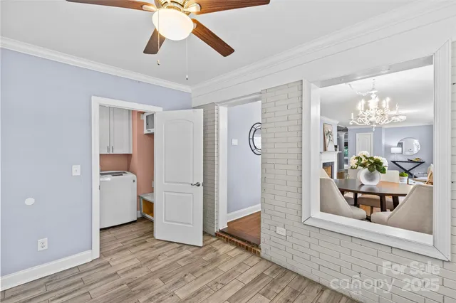 a view of a hallway view with wooden floor and staircase