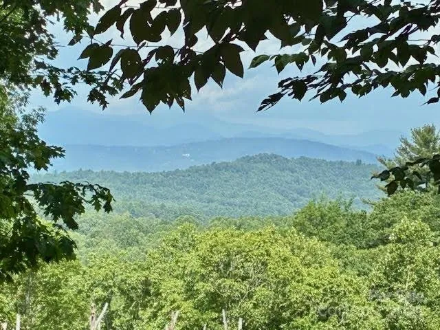 a backyard of a house with a yard and outdoor seating