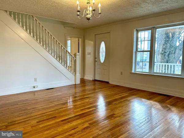 a view of livingroom with wooden floor and windows