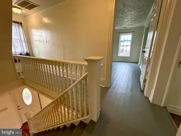 a view of entryway with wooden floor