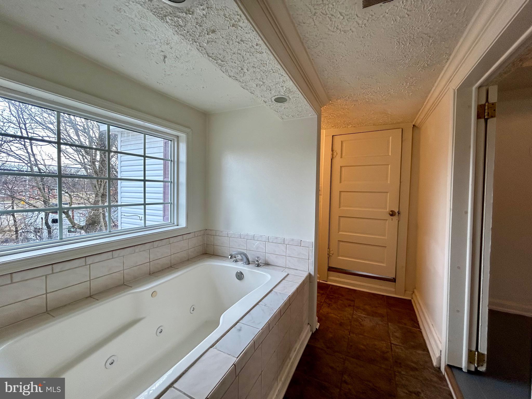 2266 Henshaw Road Inwood, WV 25428 - Photo 21 of 25 a bathroom with a bathtub and a shower
