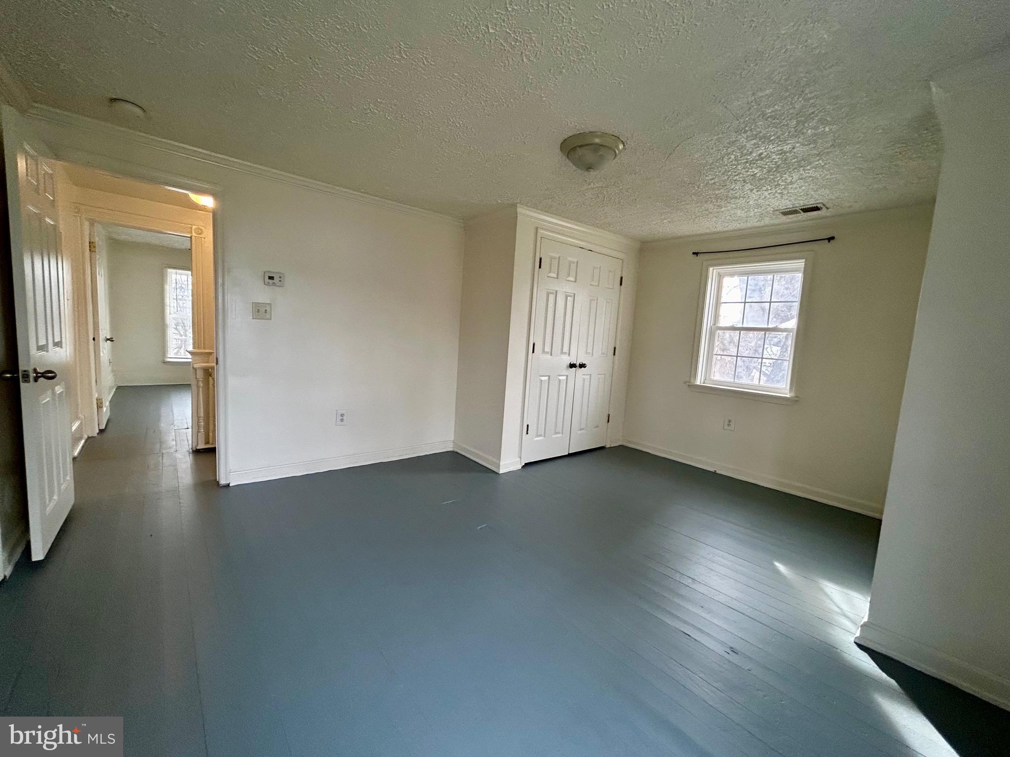 2266 Henshaw Road Inwood, WV 25428 - Photo 22 of 25 an empty room with windows