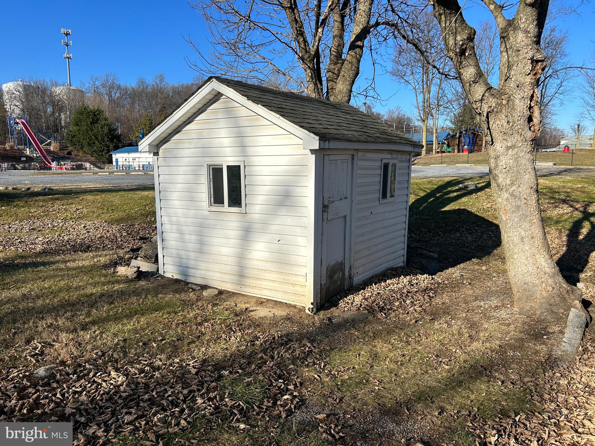 2266 Henshaw Road Inwood, WV 25428 - Photo 4 of 25 a front view of a house with a yard
