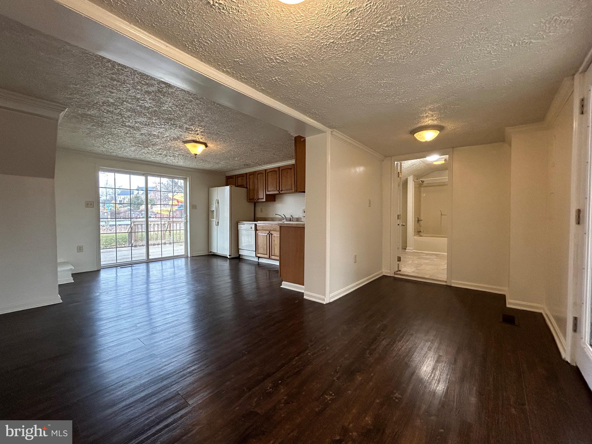 2266 Henshaw Road Inwood, WV 25428 - Photo 7 of 25 a view of an empty room with wooden floor and a window