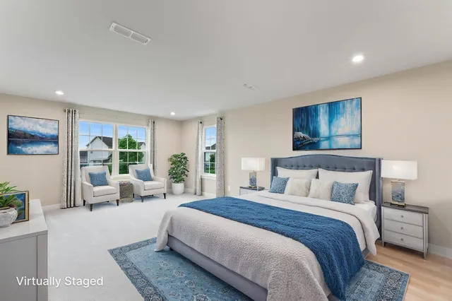 a bedroom with a large bed and a large window