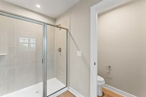 an aerial view of residential houses with outdoor space and street view