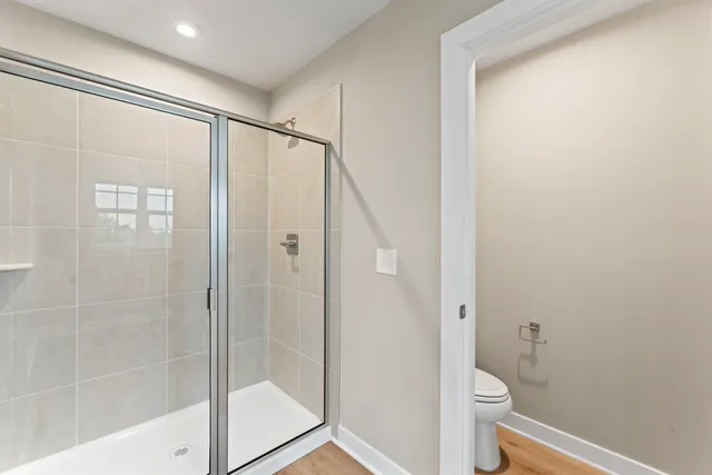 an aerial view of residential houses with outdoor space and street view