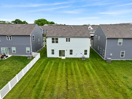 a view of a yard in front of a house with a big yard