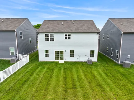 a aerial view of a house with a big yard