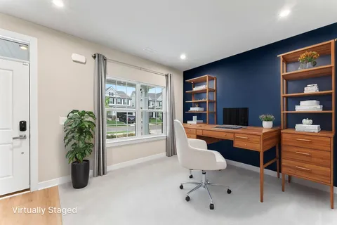 a room with furniture piano and window