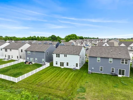 a view of house with backyard space