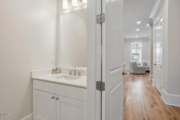 a kitchen with a sink a table and chairs