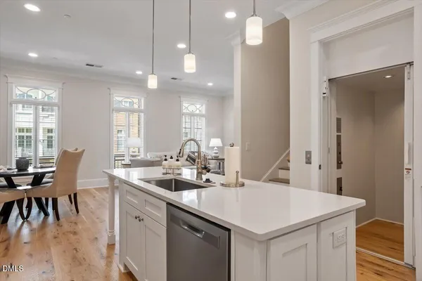 a view of a kitchen island wooden floor and windows