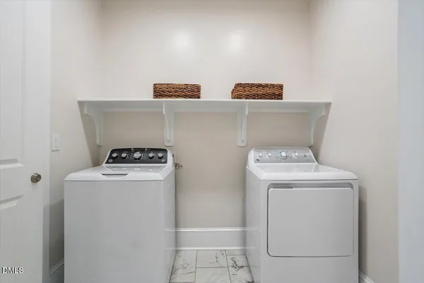 a spacious bedroom with a bed and a window