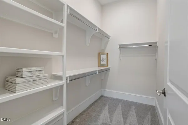 a bathroom with a double vanity sink mirror and shower