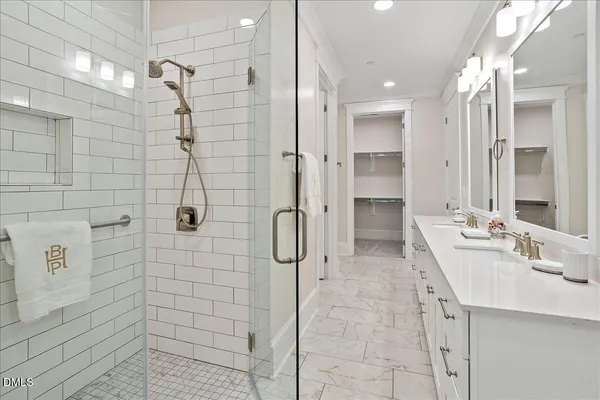 a bathroom with a double vanity sink mirror and double