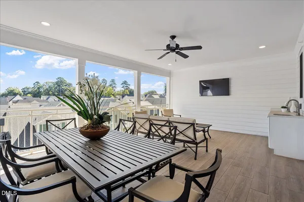a view of a double vanity sink with wooden floor