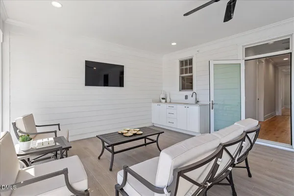 a living room with furniture and windows