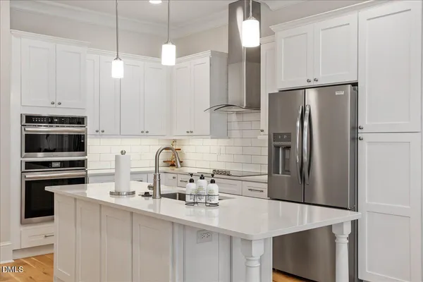 a kitchen with a sink stove and refrigerator