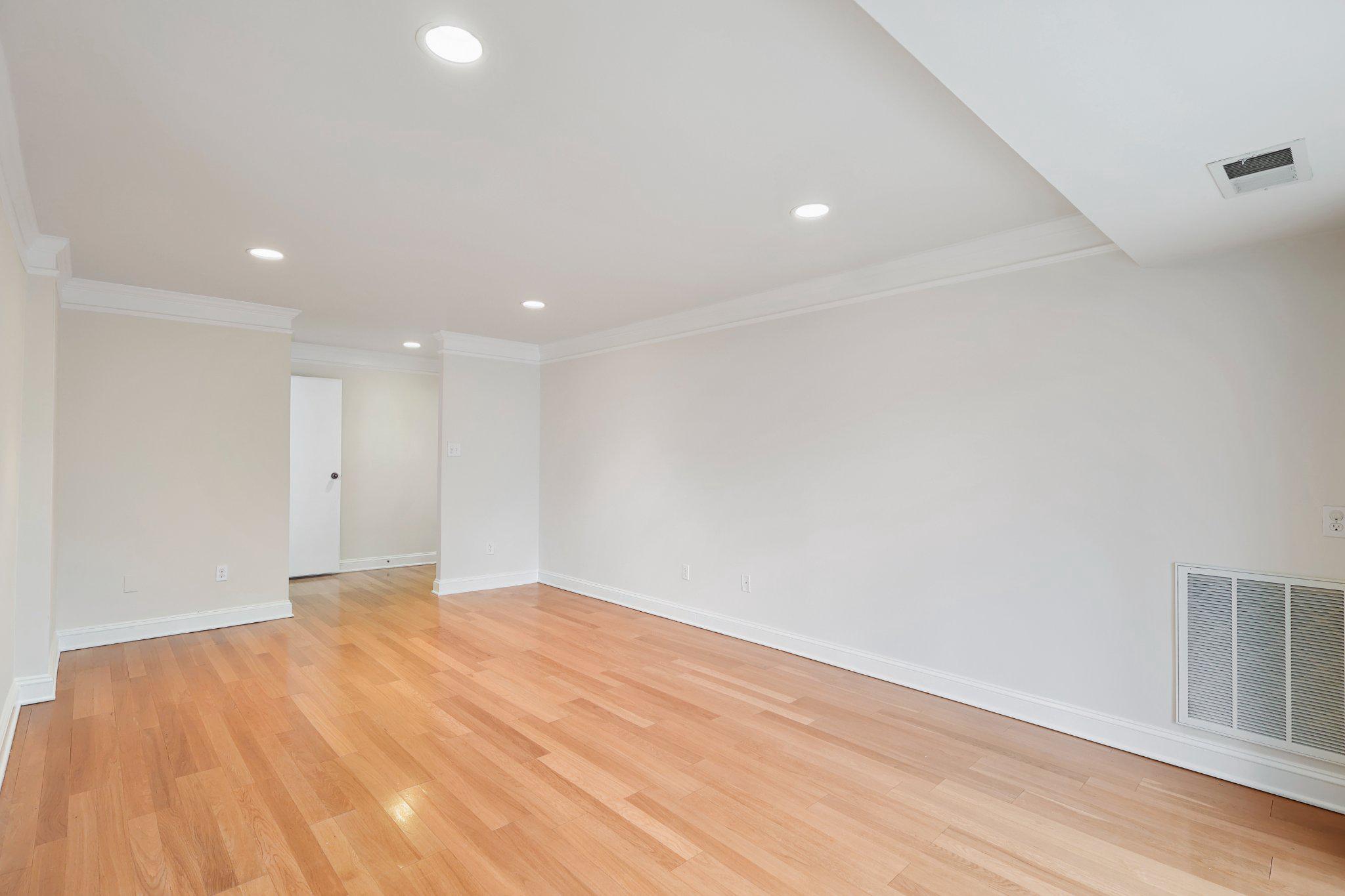 2037 Royal Fern Court, Unit 47/2C Reston, VA 20191 - Photo 12 of 48 a view of empty room with wooden floor