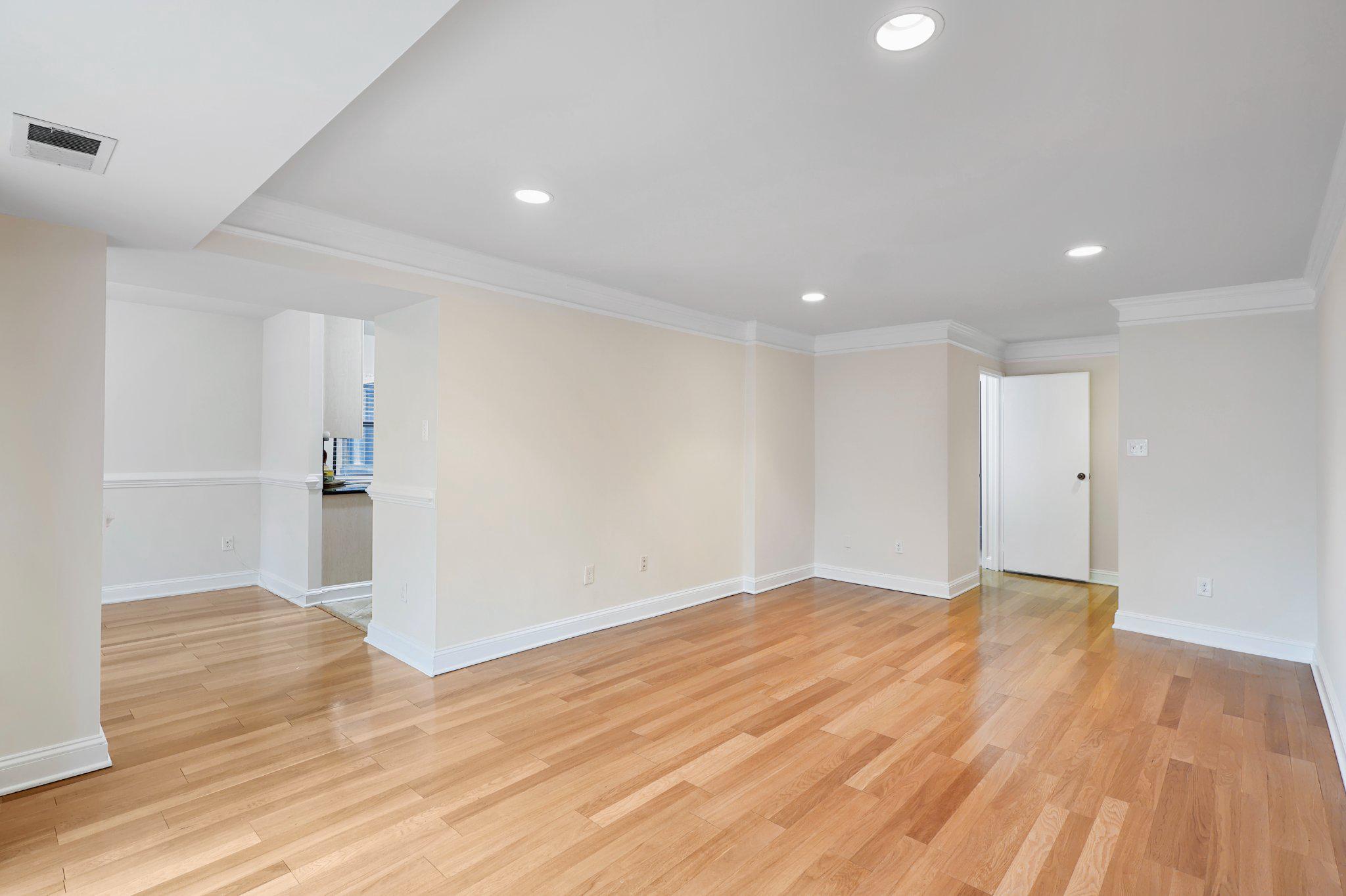 2037 Royal Fern Court, Unit 47/2C Reston, VA 20191 - Photo 13 of 48 a view of empty room with wooden floor