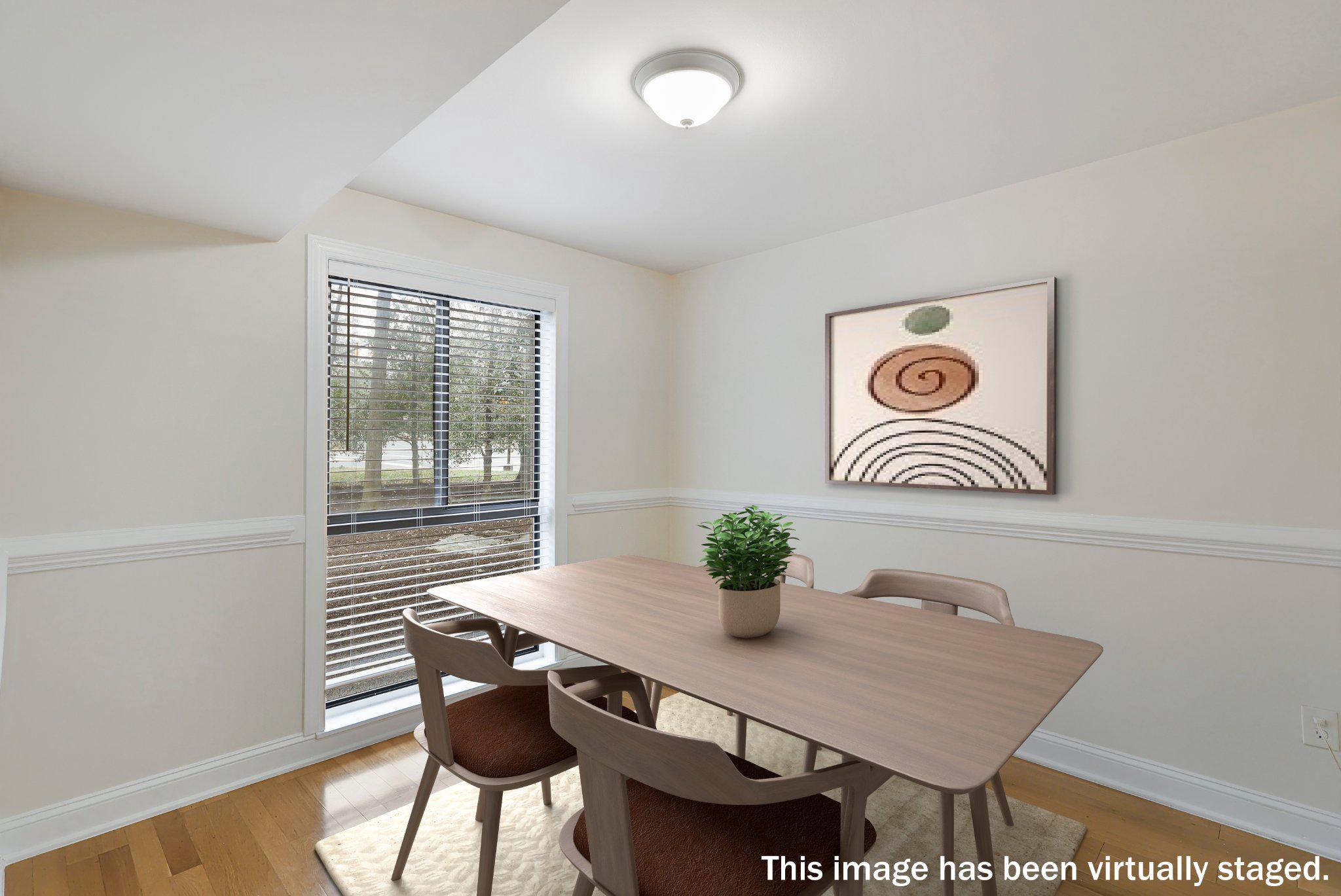 2037 Royal Fern Court, Unit 47/2C Reston, VA 20191 - Photo 14 of 48 a view of a dining room with furniture and wooden floor