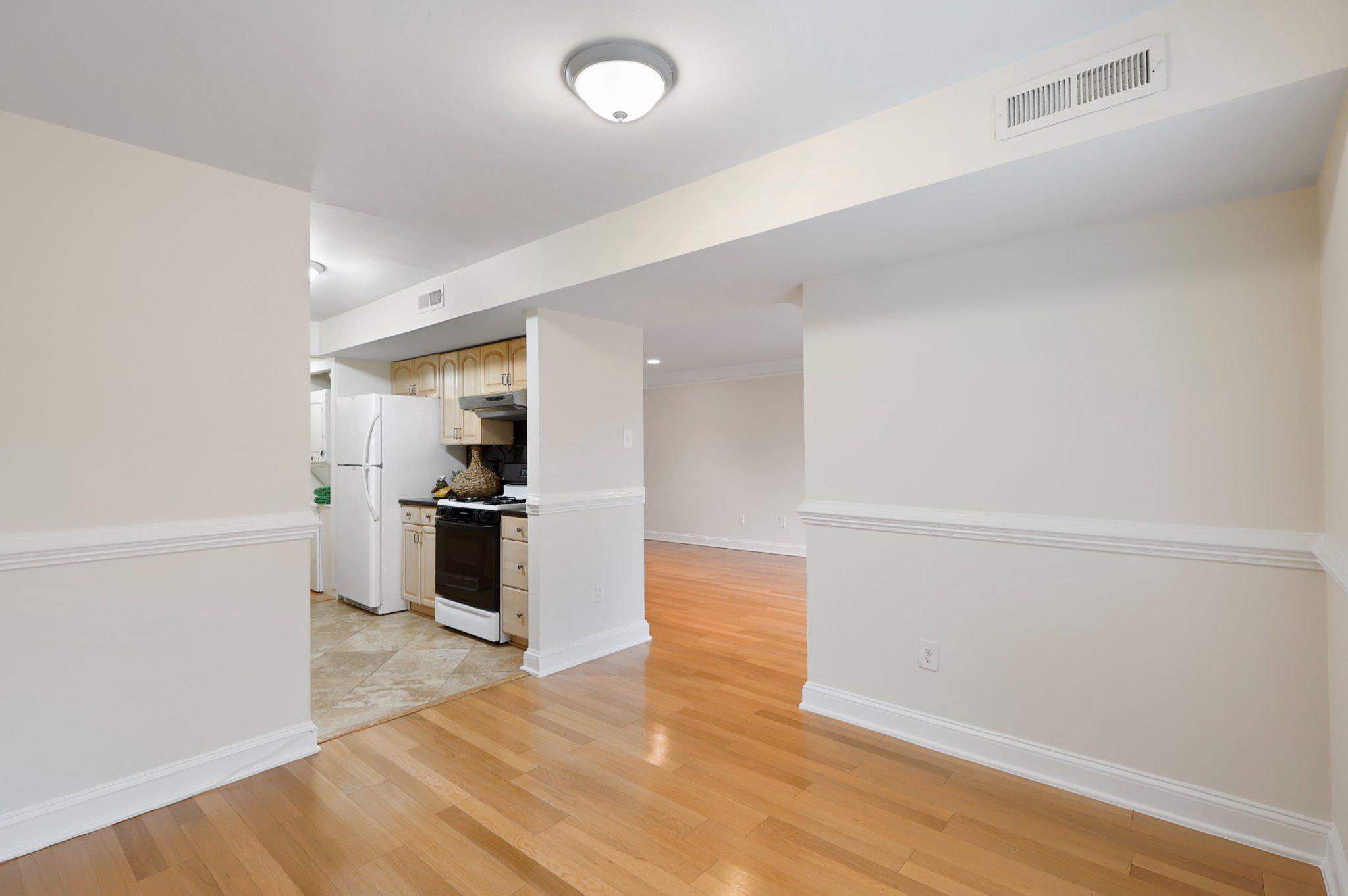 2037 Royal Fern Court, Unit 47/2C Reston, VA 20191 - Photo 16 of 48 a view of a kitchen with a sink and a stove top oven