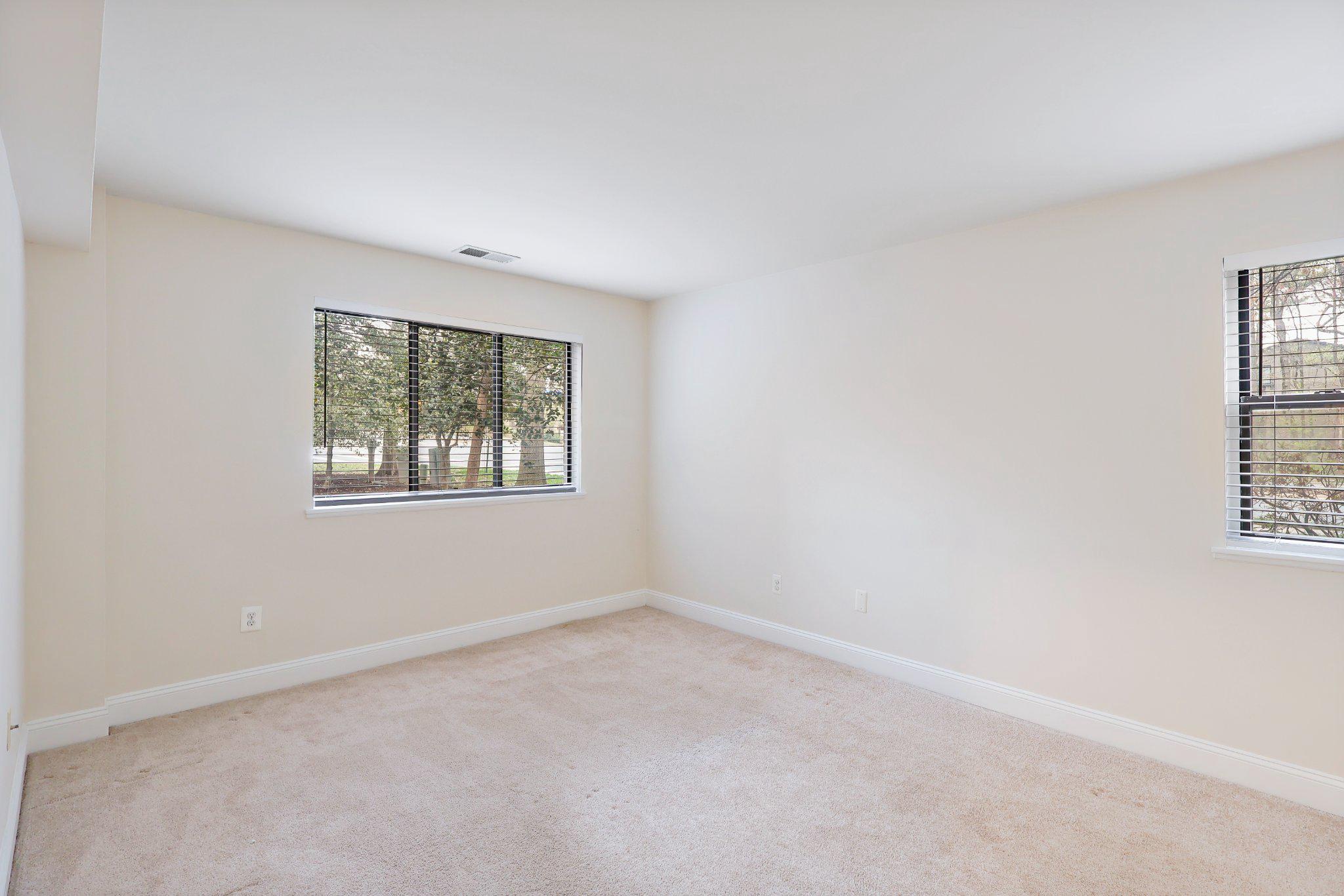 2037 Royal Fern Court, Unit 47/2C Reston, VA 20191 - Photo 23 of 48 an empty room with windows
