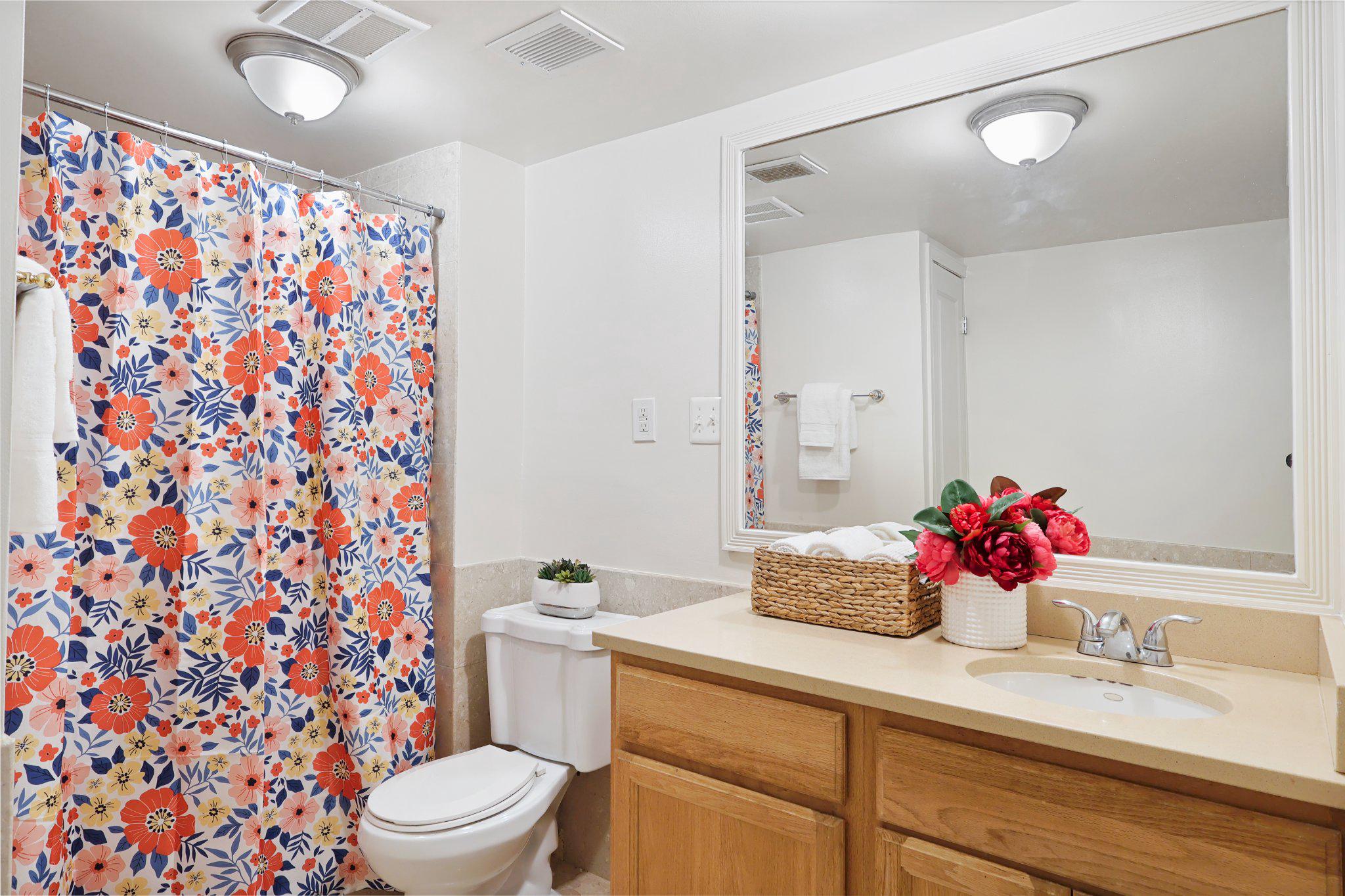 2037 Royal Fern Court, Unit 47/2C Reston, VA 20191 - Photo 27 of 48 a bathroom with a sink and a mirror