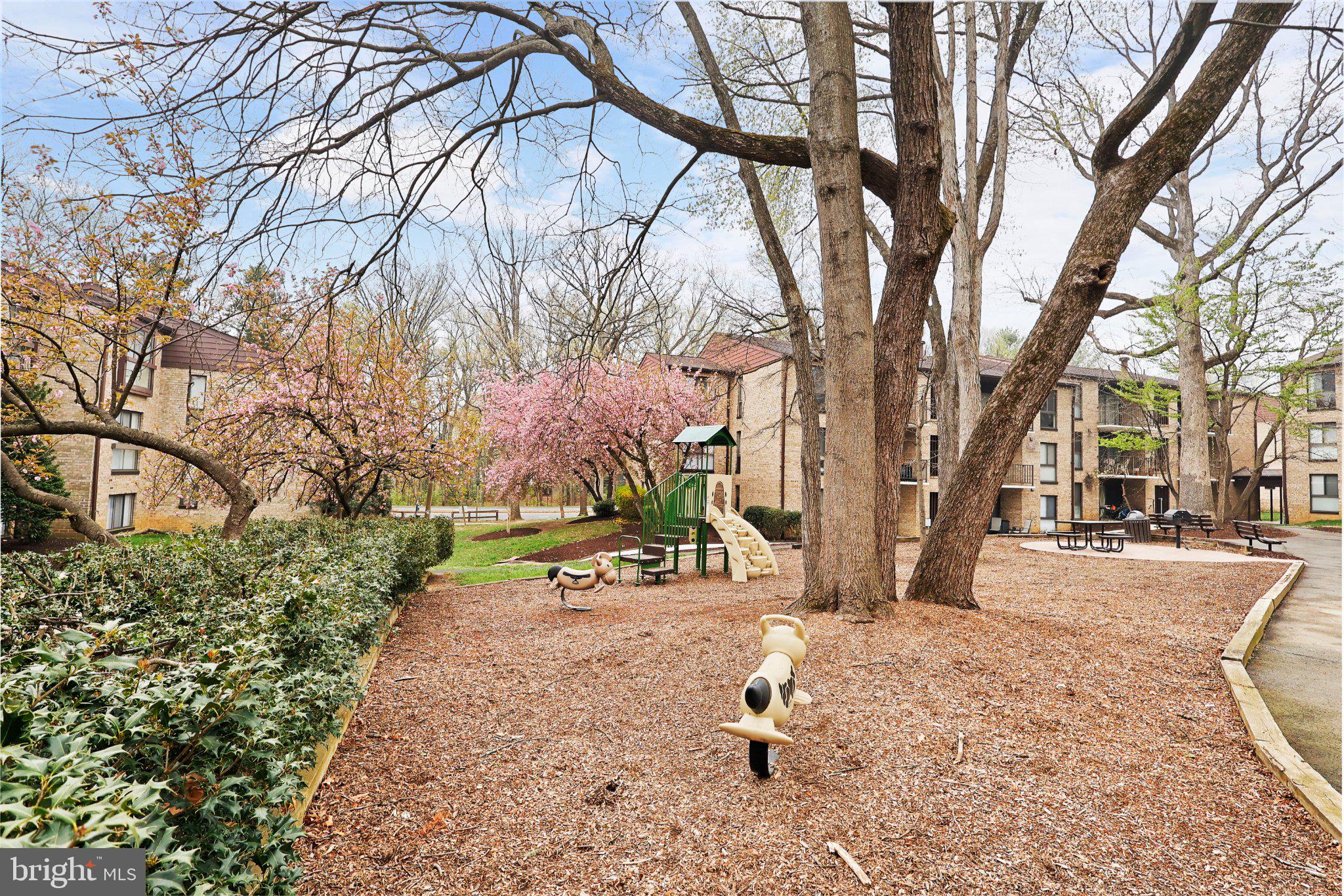 2037 Royal Fern Court, Unit 47/2C Reston, VA 20191 - Photo 40 of 48 a view of a fire pit with large trees