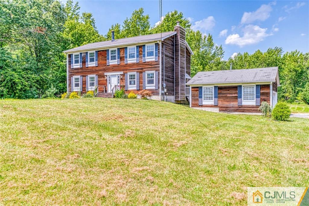 207 Fresh Ponds Road Monroe Township, NJ 08831 - Photo 1 of 25 a front view of a house with a yard