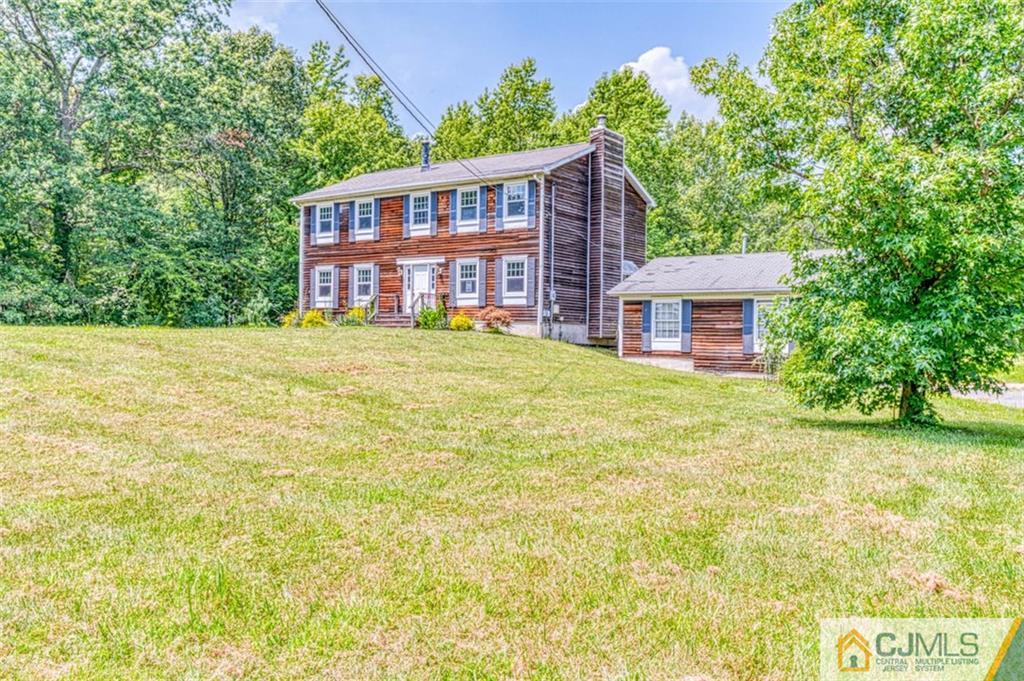 207 Fresh Ponds Road Monroe Township, NJ 08831 - Photo 2 of 25 a view of a house with a swimming pool