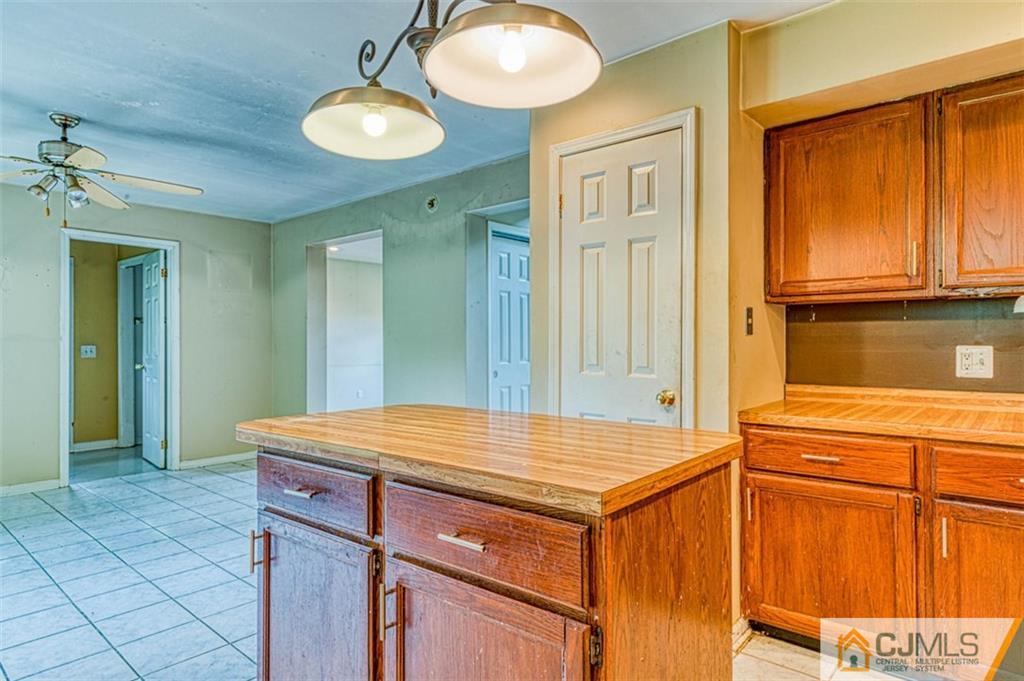 207 Fresh Ponds Road Monroe Township, NJ 08831 - Photo 11 of 25 a room with a table and chairs