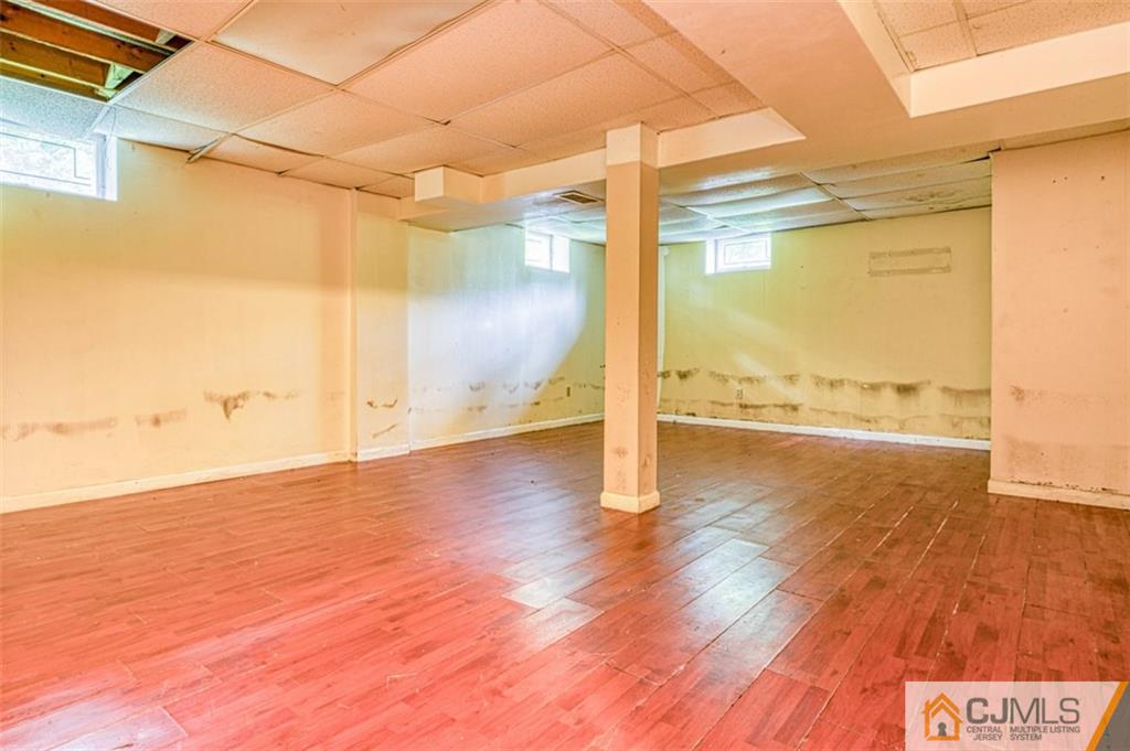 207 Fresh Ponds Road Monroe Township, NJ 08831 - Photo 17 of 25 a view of an empty room and wooden floor