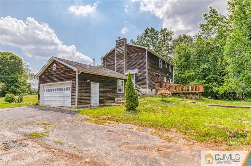 207 Fresh Ponds Road Monroe Township, NJ 08831 - Photo 5 of 25 a view of a house with pool and a yard