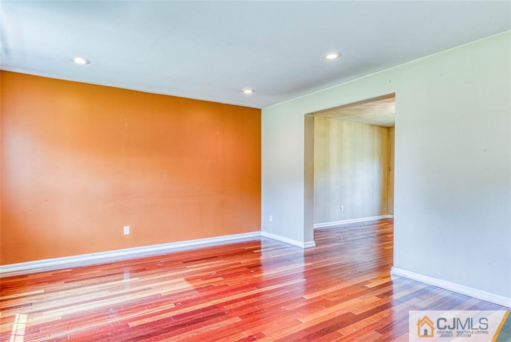 207 Fresh Ponds Road Monroe Township, NJ 08831 - Photo 6 of 25 a view of empty room with wooden floor