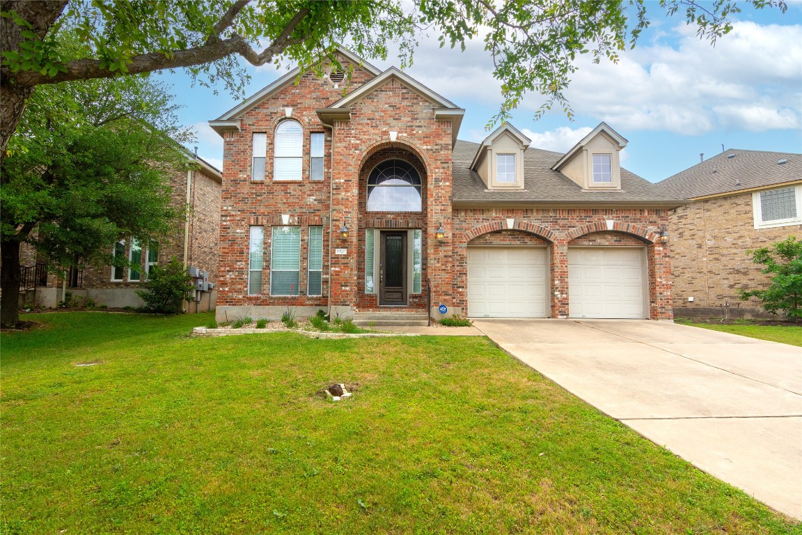 8520 Cobblestone Austin, TX 78735 - Photo 1 of 1 a front view of a house with garden