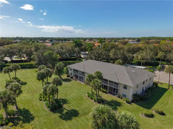 an aerial view of house with yard and mountain view