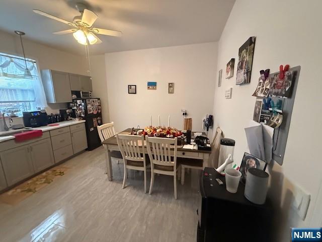 210 Hoboken Road, Unit 2A East Rutherford, NJ 07073 - Photo 11 of 15 a dining room with furniture and window